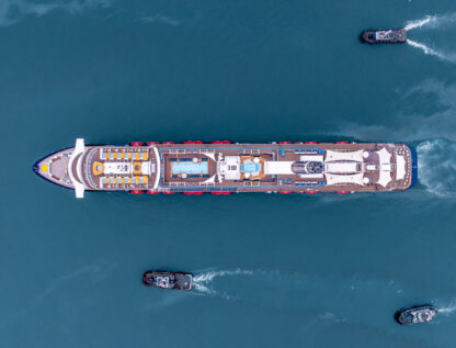 Aerial view luxury ocean cruise ship on clam blue sea, Elegant modern travel lifestyle, Luxury cruise ship liner modern maritime business ocean tourism, Global business cruise ship liner industry.